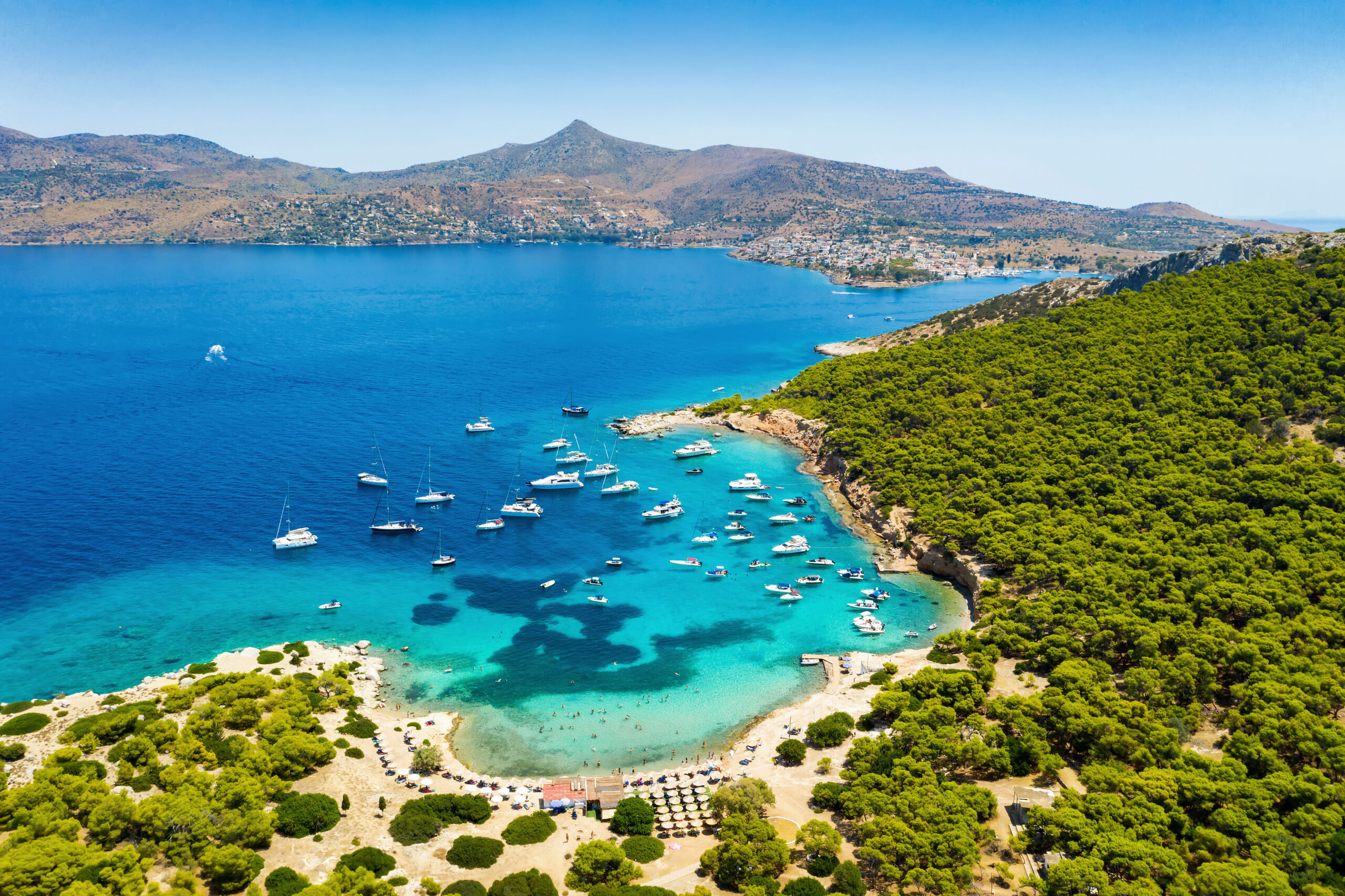 Aerial view to the beautiful beach of Moni island, next to the village Perdika on Aegina island with turquoise sea, Saronic Gulf, Greece