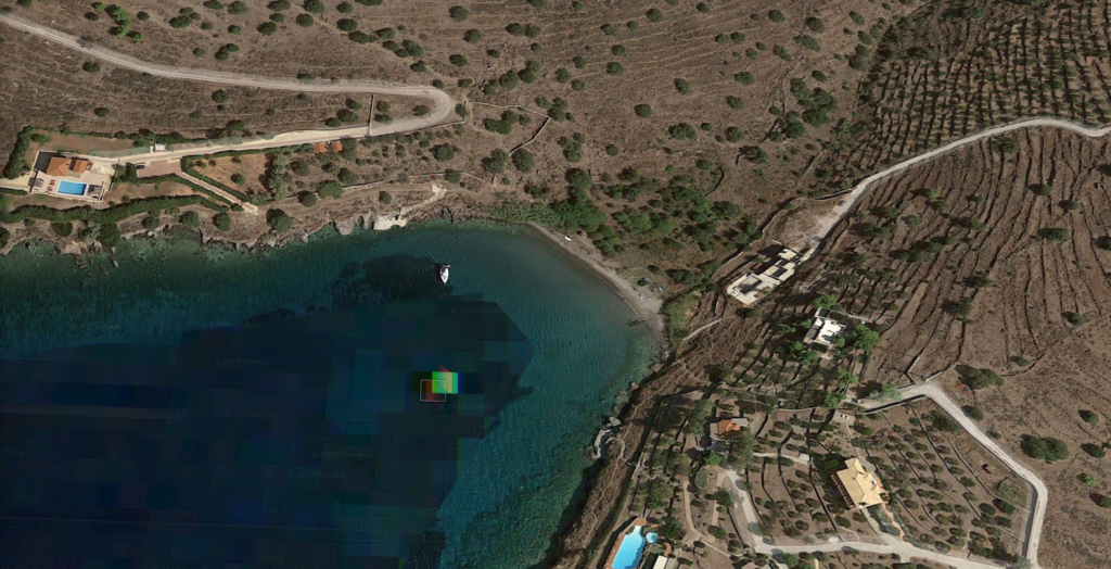 The coved shaped Unnamed beach, in Mazioti, Aegina, Greece as can be seen from the satellite view. Copyrights: Google Inc.